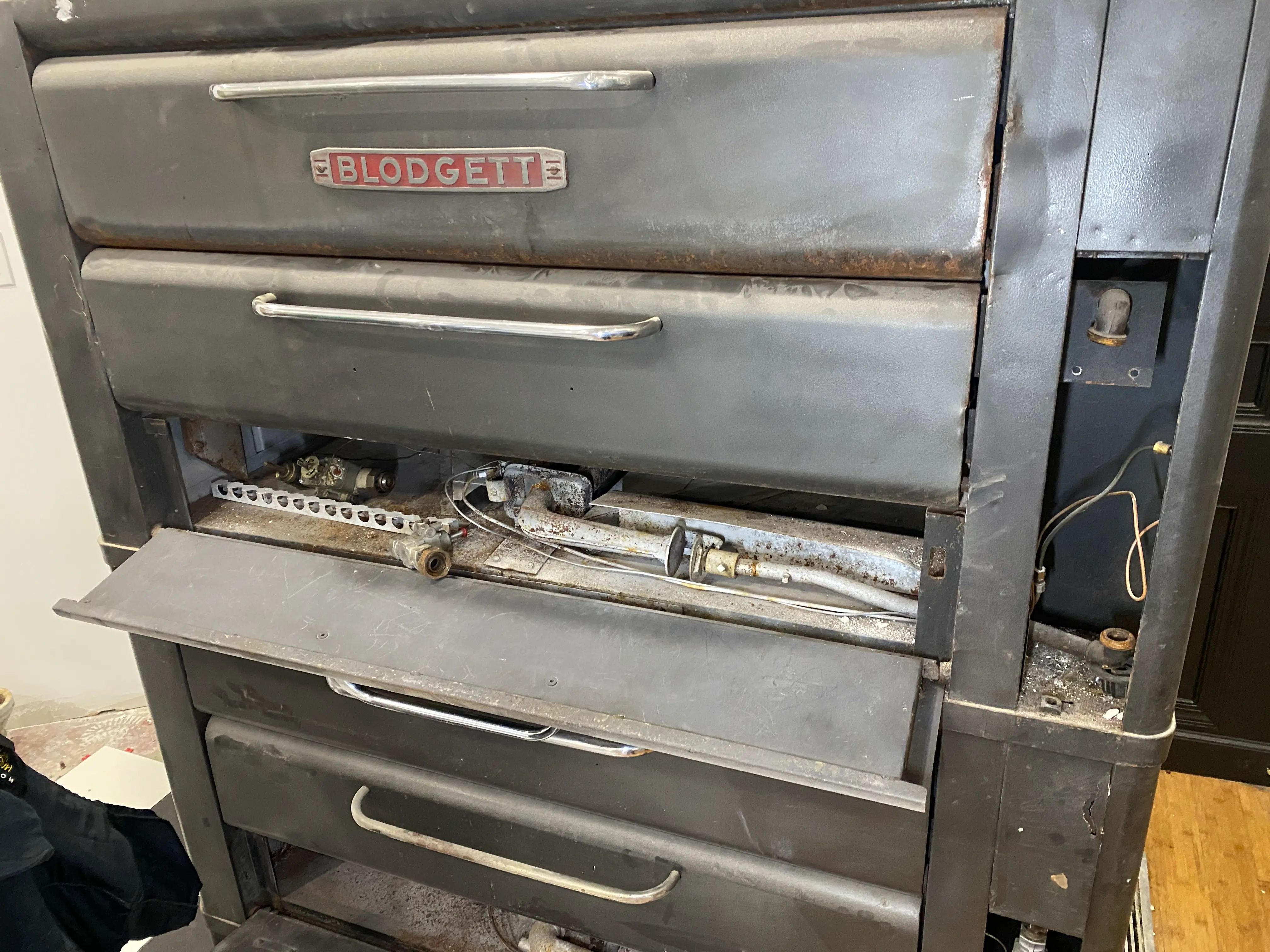 Commercial oven repair in progress
