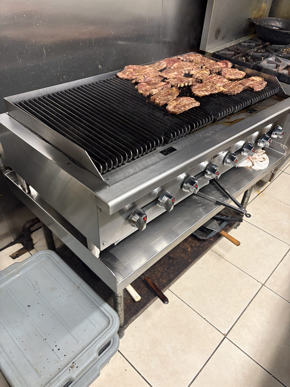 Commercial charbroiler grill in a working Philadelphia kitchen