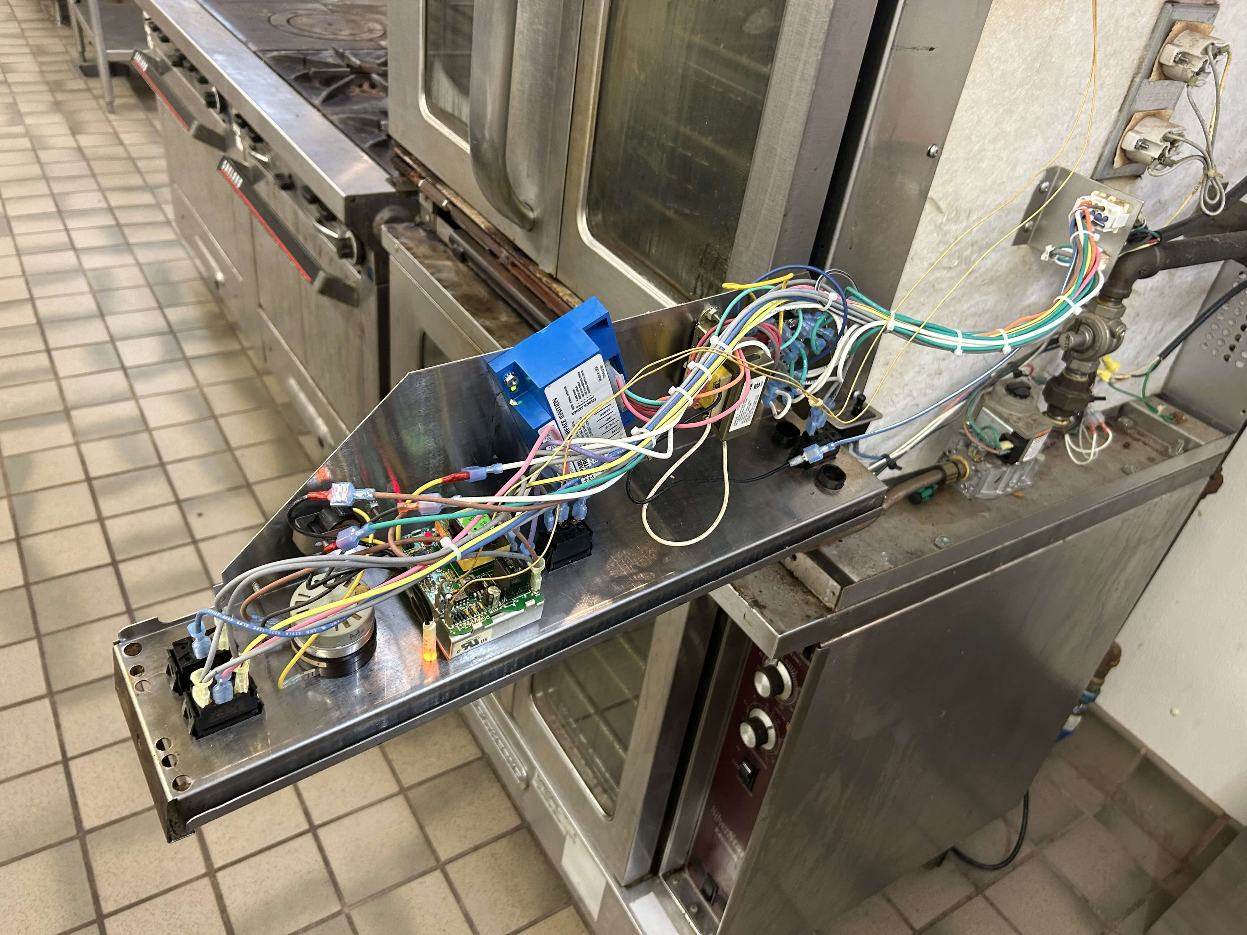 Commercial convection oven being repaired in Philadelphia kitchen
