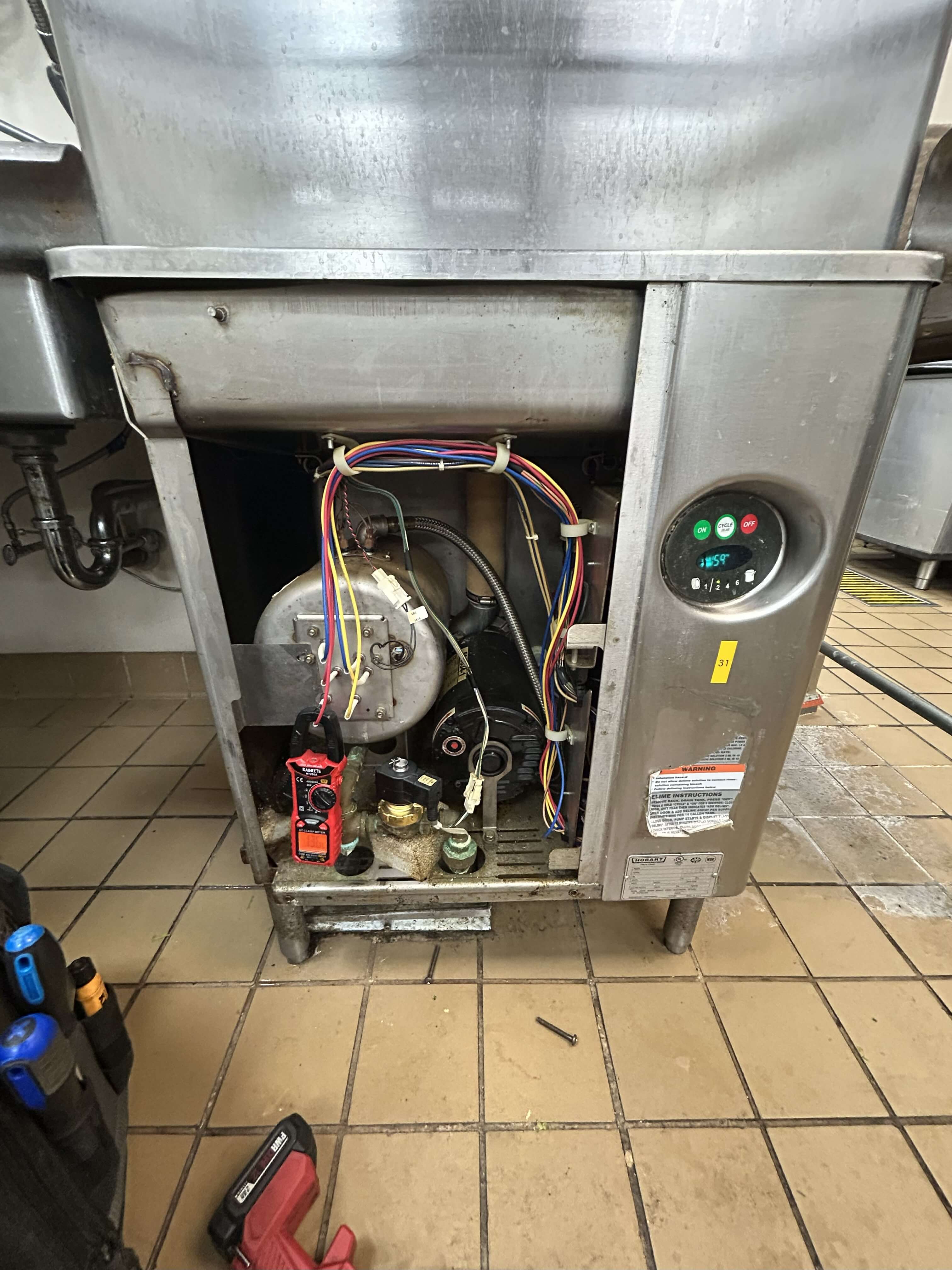 Commercial dishwasher and warewashing station serviced in a Philadelphia kitchen