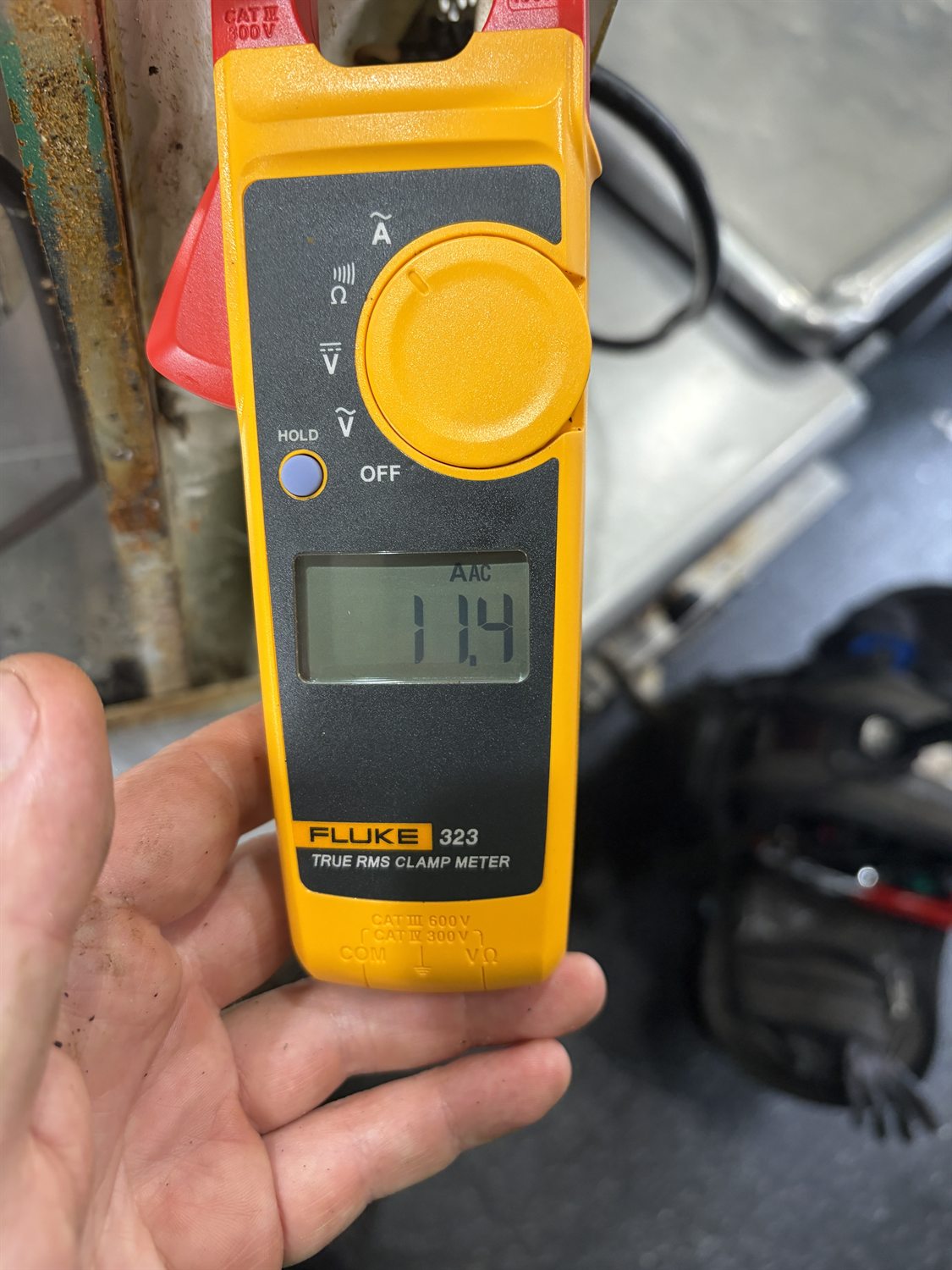 Clamp meter reading current during a commercial fryer electrical diagnosis in Philadelphia